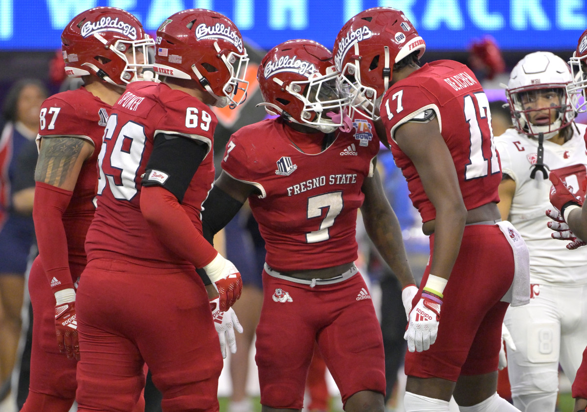 Dec 17, 2022; Inglewood, CA, USA; Fresno State Bulldogs running back Jordan Mims (7) celebrates with offensive lineman Jacob Spomer (69) and tight end Kamron Beachem (17) after scoring a touchdown against the Washington State Cougars in the second half of the LA Bowl at SoFi Stadium. Mandatory Credit: Jayne Kamin-Oncea-USA TODAY Sports